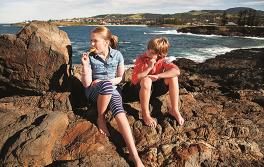 Kids eating ice cream on Kiama beach, South Coast